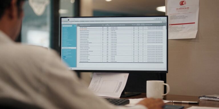 buy laptops in bulk — procurement manager comparing three reseller quotes for a 100-laptop PO in a Navi Mumbai office, Sirius Star
