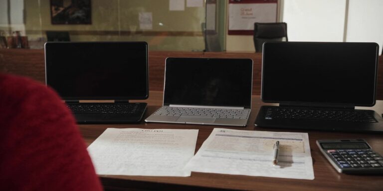 Lenovo ThinkPad price in india - Bengaluru procurement desk with three ThinkPad lids and CFO PO template, Sirius Star