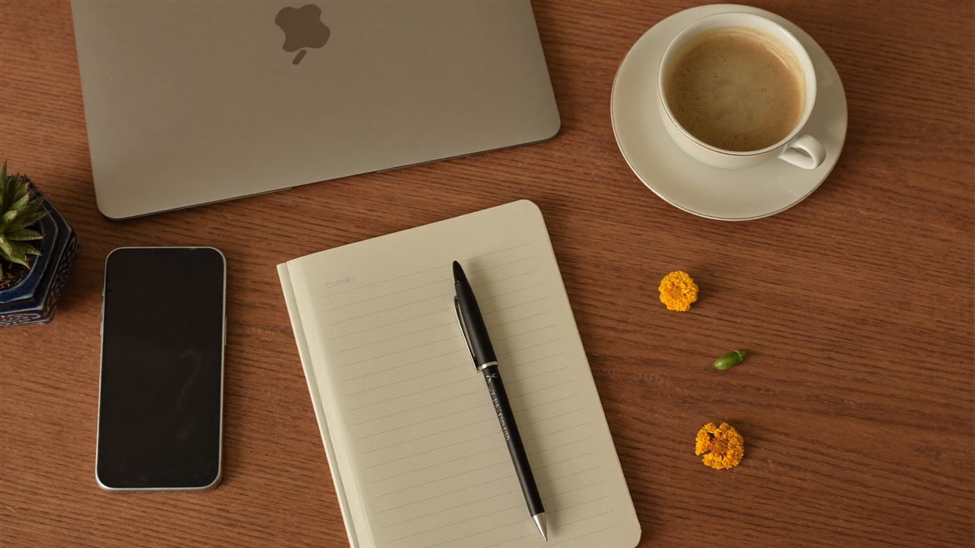 Google Workspace India tenant review flat-lay desk Mumbai office Sirius Star session notebook chai