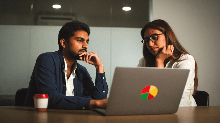 Indian SaaS co-founders Bengaluru Friday evening comparing zoho one vs microsoft 365 for indian smbs at desk with laptop