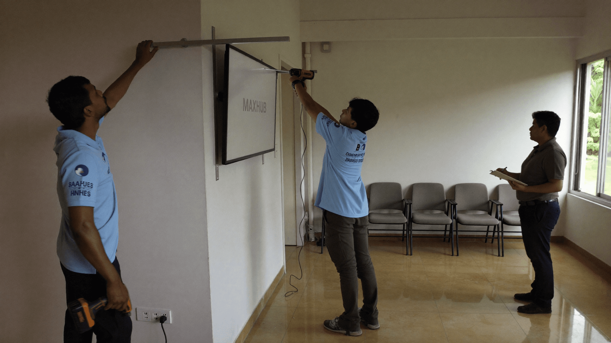 MAXHUB V6 86-inch interactive display being wall-mounted in a Pune training room