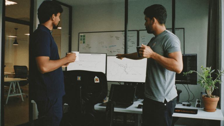 Network operations bay at a Bengaluru SaaS firm comparing latency between a legacy firewall stack and a Cato Networks SASE pilot